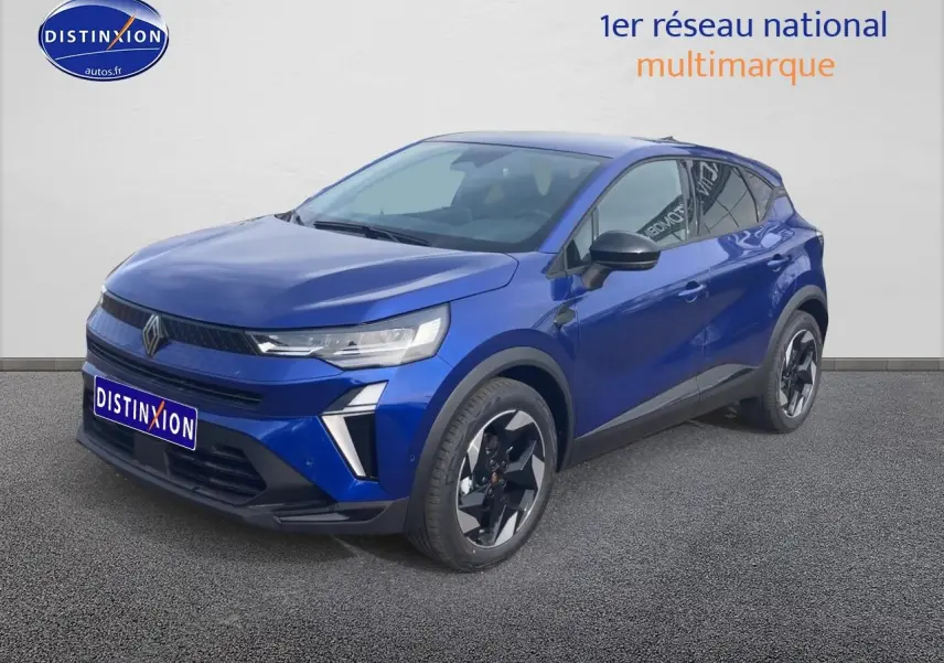 Renault Captur 2025 Bleu Iron en 3/4 avant droit, jantes alu noires et détails noirs contrastants.