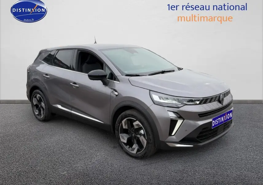 Renault Symbioz gris schiste en 3/4 avant droit, avec jantes alliage 18 pouces et feux LED distinctifs.