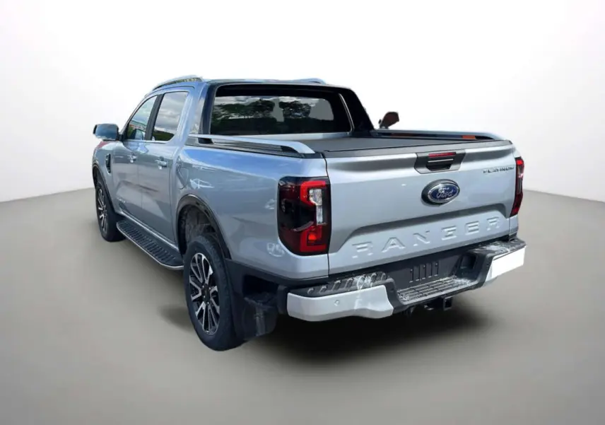 Ford Ranger 3.0 V6 gris iconic vu 3/4 arrière droit, double cabine avec benne et barres de toit visibles.