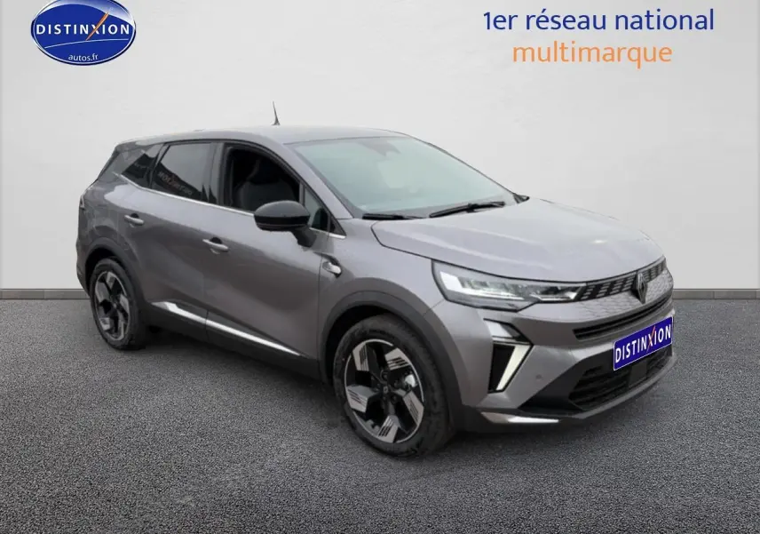 Renault Symbioz gris schiste en 3/4 avant droit, avec jantes alliage et feux LED distinctifs.