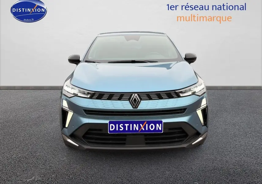 Vue avant d'une Renault Symbioz bleu mercure avec calandre noire et phares LED allumés.