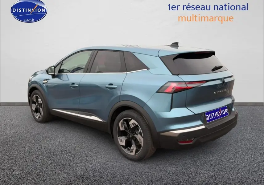 Renault Symbioz bleu mercure en 3/4 arrière droit, avec feux LED et jantes alliage 18 pouces design gravity.