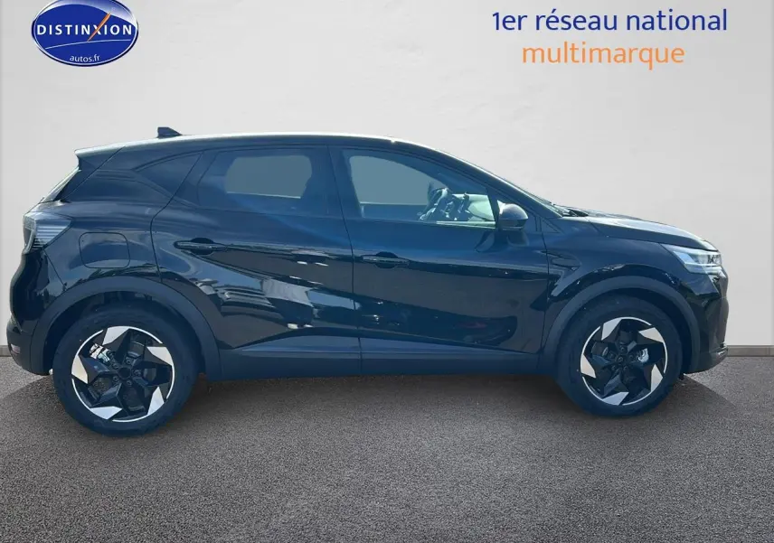 Profil droit du Renault Captur 1.6 e-tech hybride 2025 en noir étoile avec jantes alu bicolores.