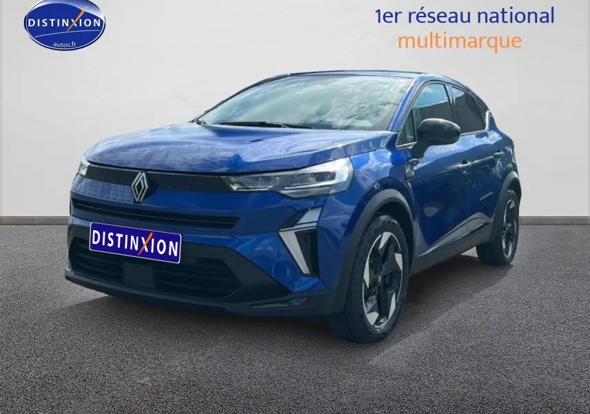 Renault Captur 2025 bleu iron en 3/4 avant droit, avec jantes alu et feux LED distinctifs.