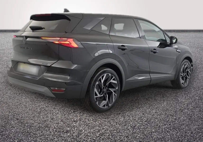 Vue 3/4 arrière droite du Renault Symbioz noir avec feux LED et jantes au design géométrique.