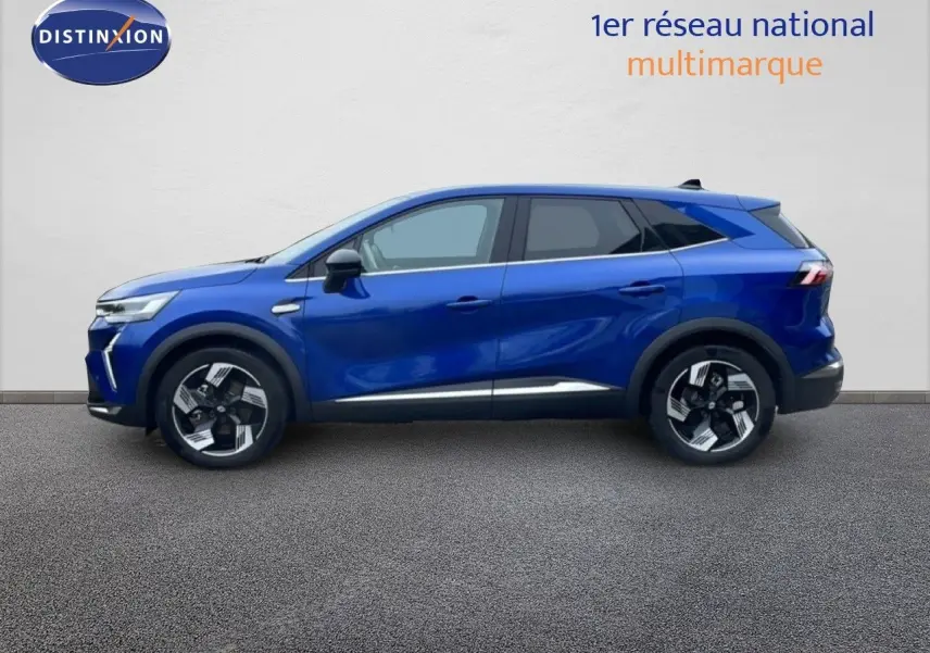 Profil côté gauche du Renault Symbioz 2025 bleu iron metal, SUV hybride avec jantes alliage bicolores et lignes dynamiques.