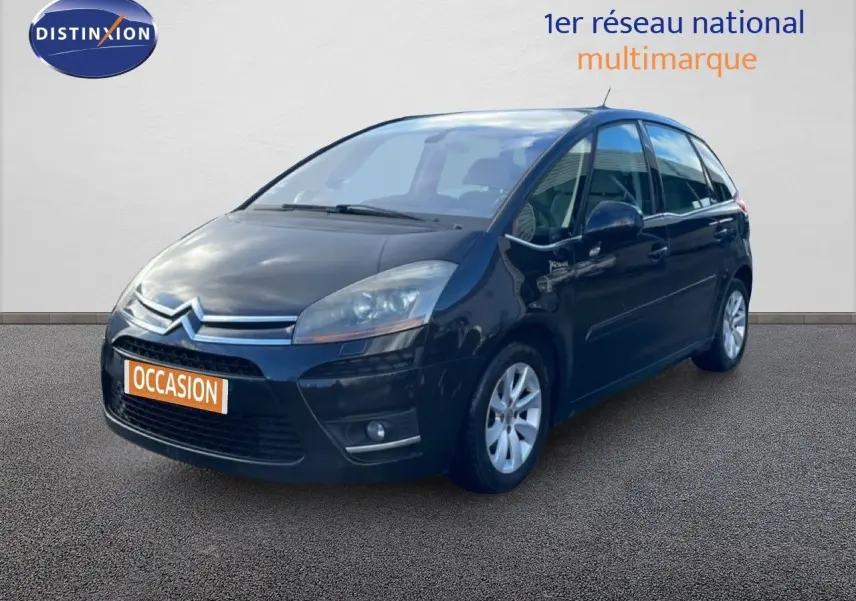 Citroën C4 Picasso noir métal vue 3/4 avant droit avec jantes alliage et calandre chromée.