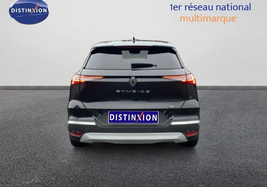 Vue arrière du Renault Symbioz noir étoile métal 2025 avec feux LED étirés et logo central lumineux.