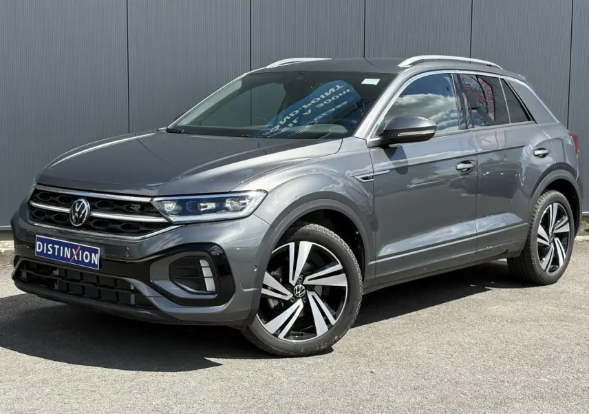 Volkswagen T-Roc gris Indium en 3/4 avant droit avec jantes alliage 18" Nevada et calandre R-Line.
