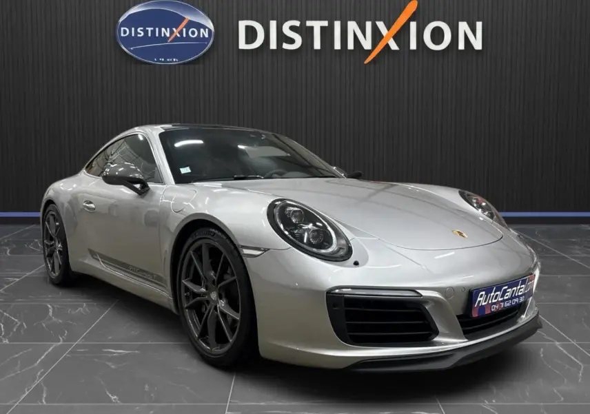 Porsche 911 991.2 Carrera T gris GT Silver vue 3/4 avant avec jantes Carrera S noires et toit ouvrant.