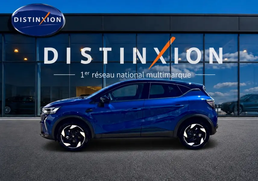 Profil latéral gauche d'un Renault Captur bleu iron avec toit noir, jantes alu et détails noirs contrastants.