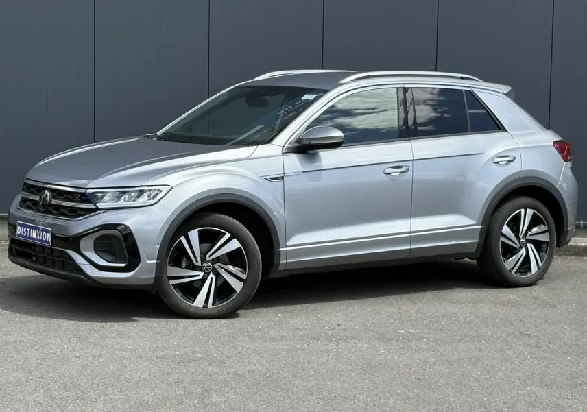 Volkswagen T-Roc 1.5 TSI R-Line gris pyrite en profil droit, avec jantes alliage 18 pouces Nevada et calandre R-Line.