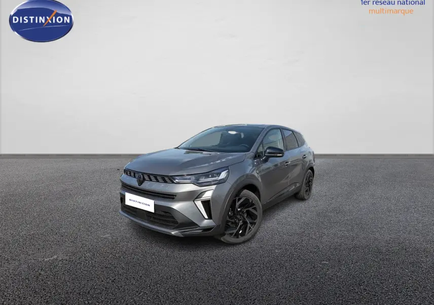 Renault Symbioz gris métallisé en 3/4 avant droit, avec jantes noires et signature lumineuse LED distinctive.