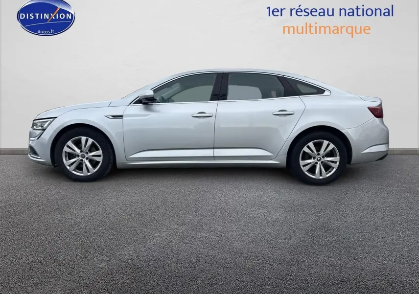 Profil latéral droit d'une Renault Talisman gris alu 2020, berline élégante aux jantes alliage visibles.