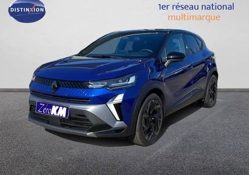 Renault Captur E-Tech hybride bleu Iron Metal avec toit noir, vue 3/4 avant côté gauche sur sol gris.