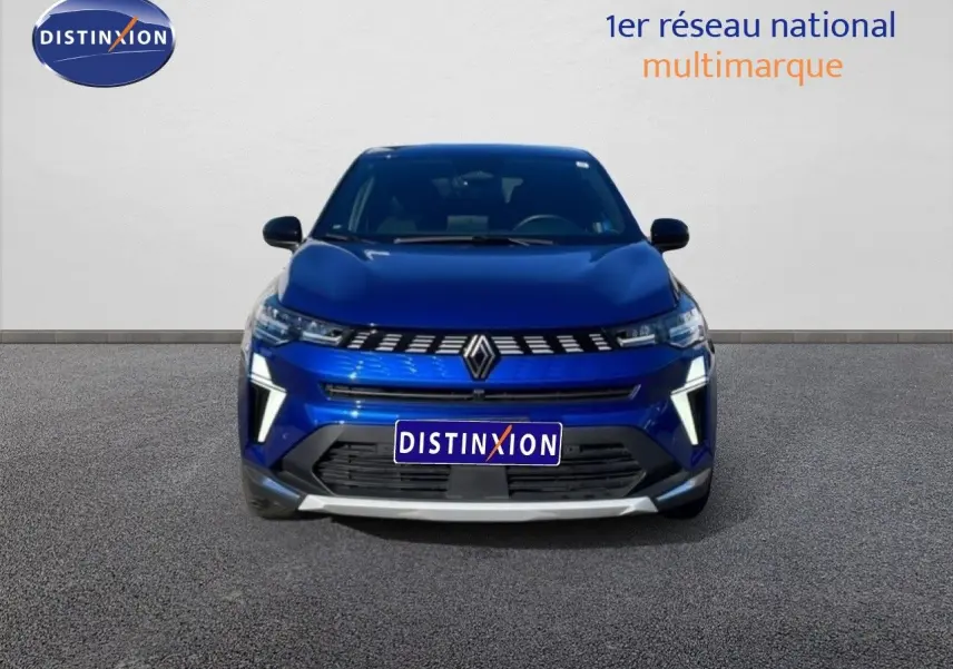 Vue de face du Renault Symbioz bleu iron metal 2025 avec calandre distinctive et éclairage LED vertical.