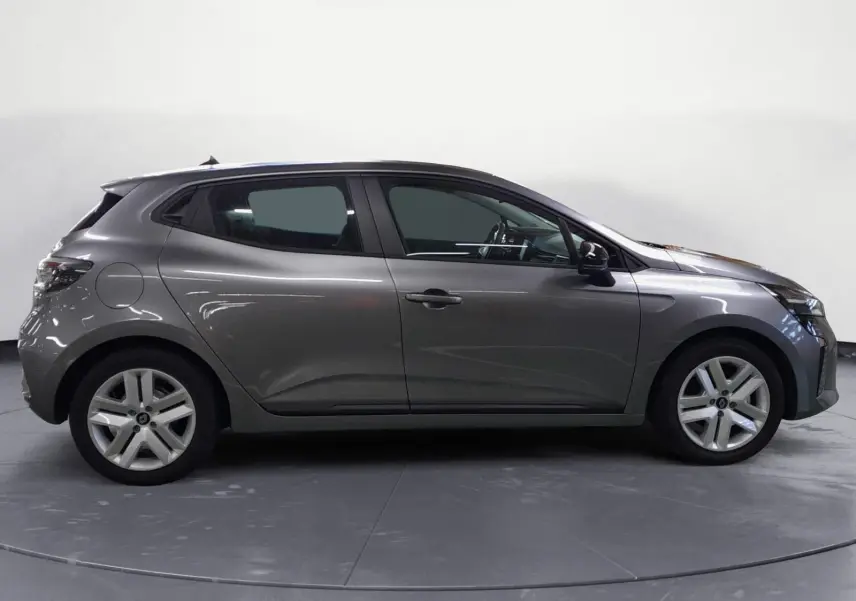 Profil côté droit de la Renault Clio V E-Tech Full Hybrid 145 gris schiste, avec jantes alliage et lignes fluides.