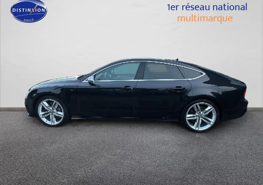 Profil droit d'une Audi S7 Sportback noire de 2013 avec jantes alu et vitres teintées sur fond neutre.