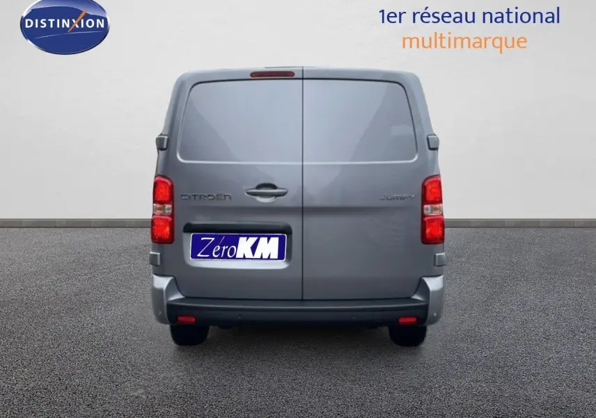 Vue arrière du Citroën Jumpy gris Artense métal avec portes battantes fermées et feux rouges visibles.