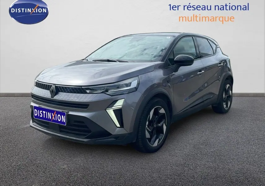 Renault Captur 2025 gris cassiopée métal avec toit noir, vue 3/4 avant droit mettant en valeur ses feux LED distinctifs.
