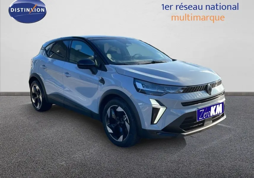 Renault Captur 2025 gris Rafale métal avec toit noir, vue 3/4 avant mettant en valeur ses optiques LED et jantes biton.