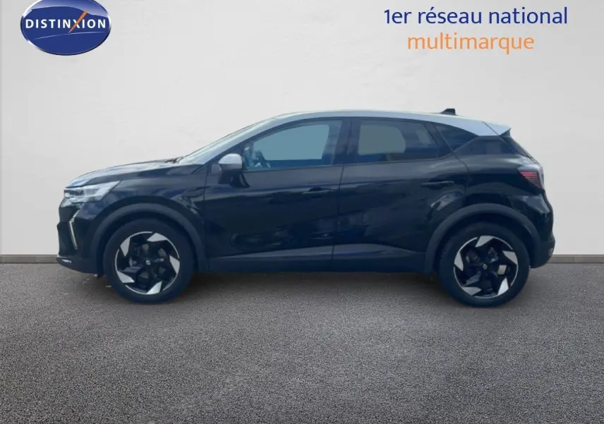 Profil latéral gauche du Renault Captur 2025 noir étoile métal avec toit gris, roues alliage bicolores distinctives.