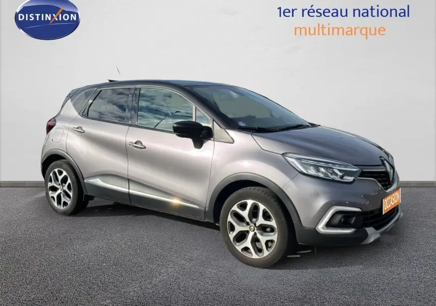 Renault Captur gris en vue de profil côté gauche, version 2019 avec détails de calandre et jantes distinctives.