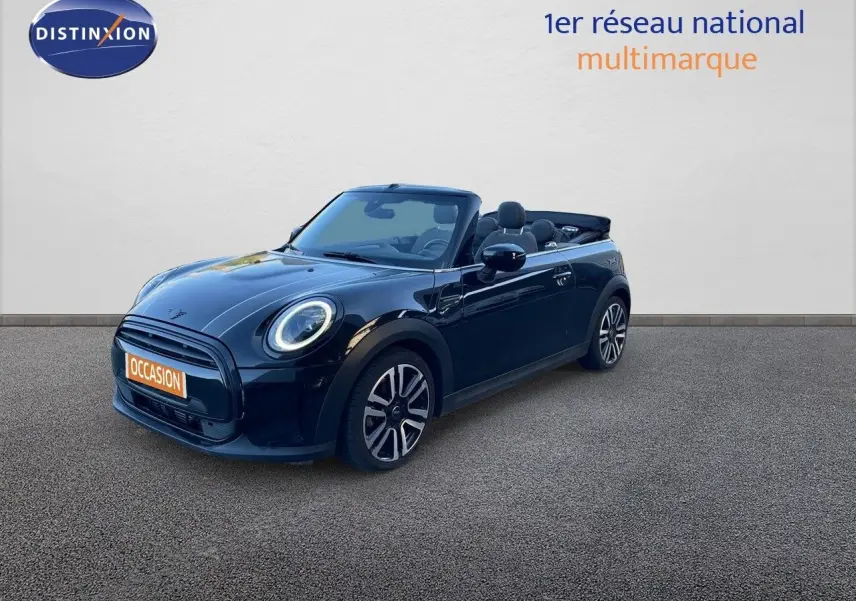 MINI Cabriolet noir Midnight Metal vue 3/4 avant avec capote ouverte et jantes bi-ton visibles.