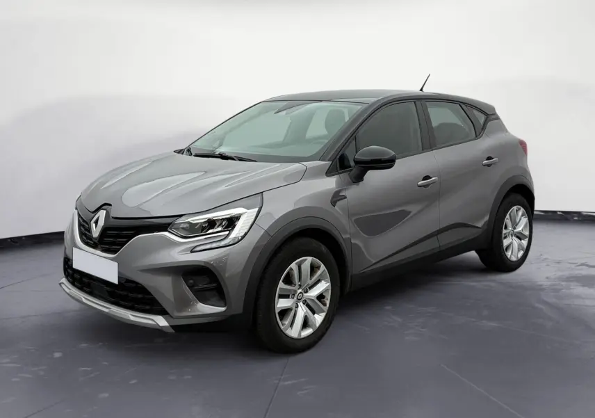 Renault Captur TCE 140 2022 gris Cassiopée avec toit noir, vue 3/4 avant droit, jantes alliage et calandre marquée.