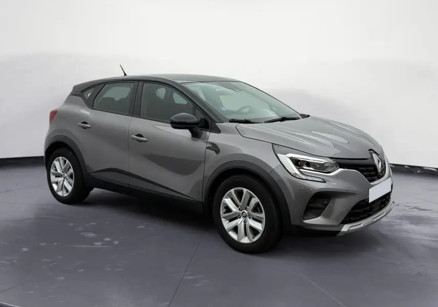 Renault Captur TCE 140 Business gris Cassiopée avec toit noir, vue 3/4 avant droit, roues 17 pouces et caméra de recul.