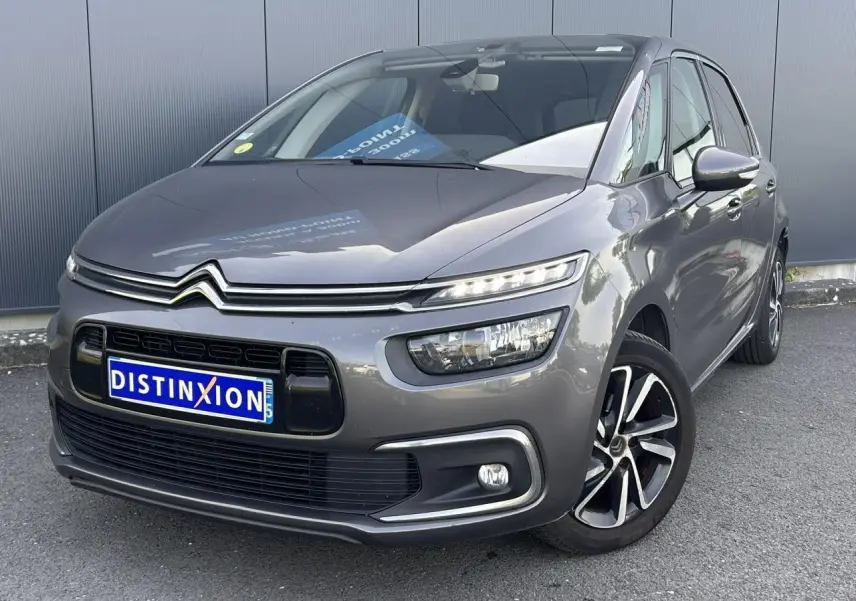Citroën C4 Spacetourer gris Platinium en 3/4 avant droit, avec jantes alliage bi-ton et feux LED allumés.