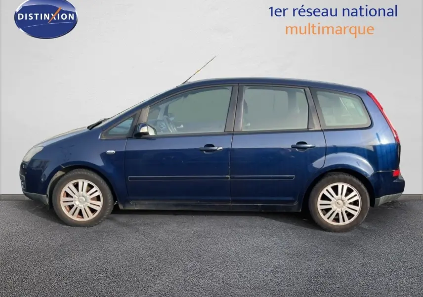 Vue latérale gauche d'une Ford C-MAX 2005 bleu foncé métallisé avec cinq portes et jantes alliage.