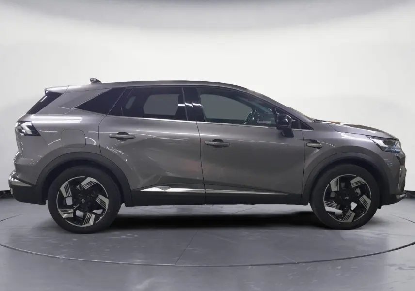 Renault Symbioz gris Casiopee en profil droit, soulignant ses jantes alliage 18'' diamantées et lignes modernes.