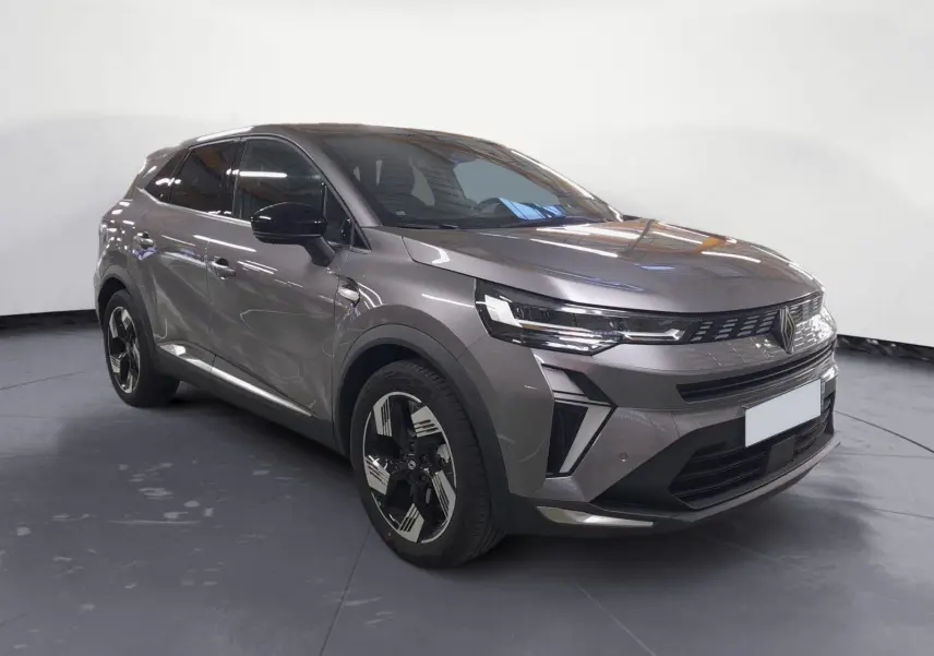 Renault Symbioz gris Casiopee en 3/4 avant droit, avec jantes alliage noires et phares LED distinctifs.