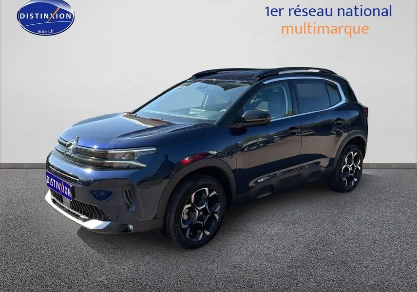 Citroën C5 Aircross bleu eclipse vue 3/4 avant droit avec jantes alu et barres de toit noires.
