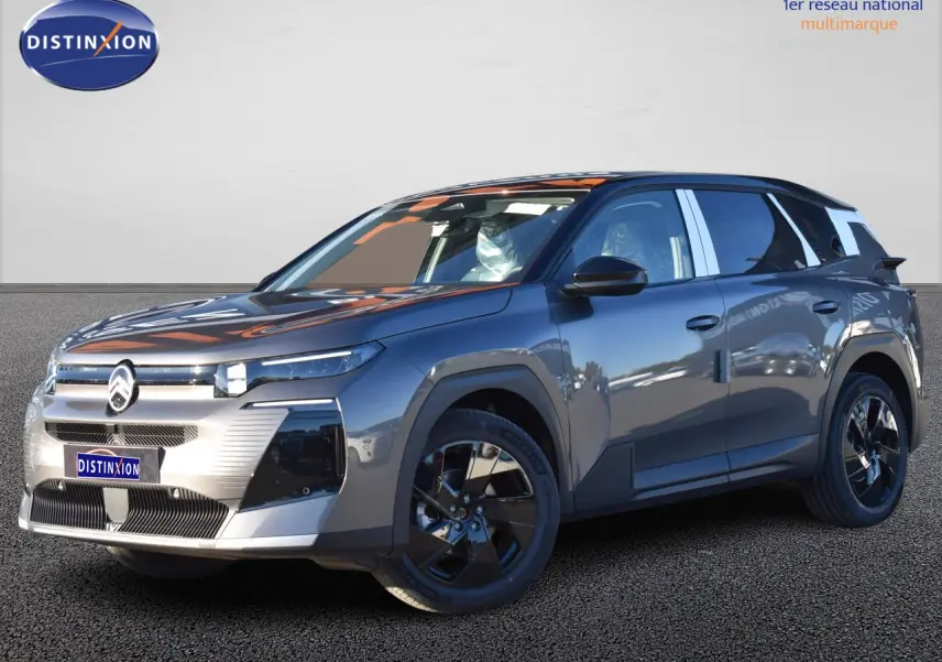 SUV Citroën C5 Aircross gris, vue 3/4 avant droit, avec toit bi-ton noir et jantes noires distinctives.