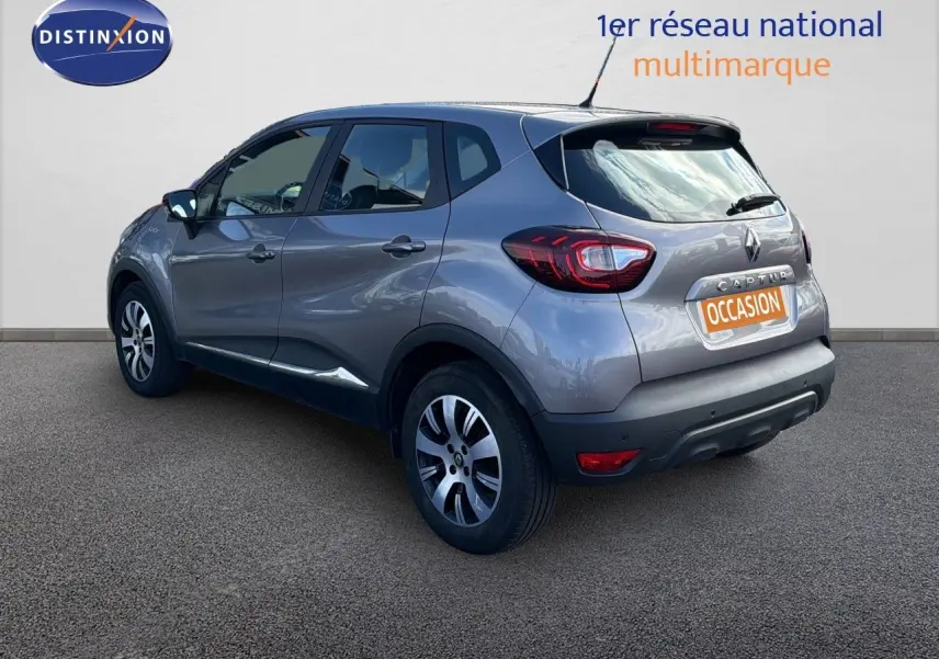 Renault Captur Zen gris cassiopée en 3/4 arrière droit, avec jantes alliage et plaque "Occasion" visible.