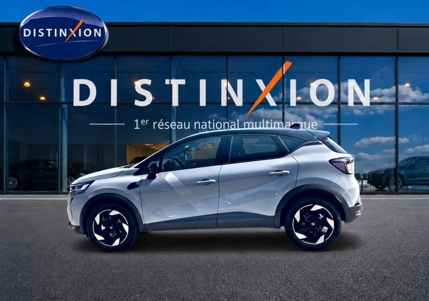 Renault Captur 1.2 TCe 115 Techno vue profil côté gauche, couleur Rafale avec toit noir et jantes alu noires.