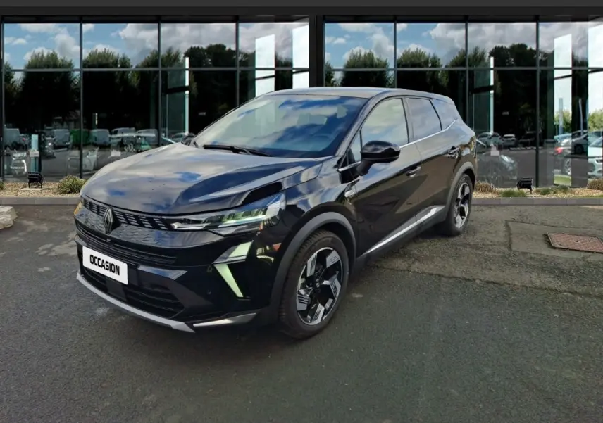 Renault Symbioz noir en 3/4 avant droit, avec phares LED et jantes au design moderne, stationné devant un bâtiment vitré.