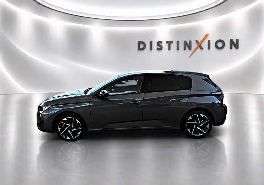 Peugeot 308 gris selenium vue de profil côté gauche, avec jantes alu et vitres arrière surteintées.