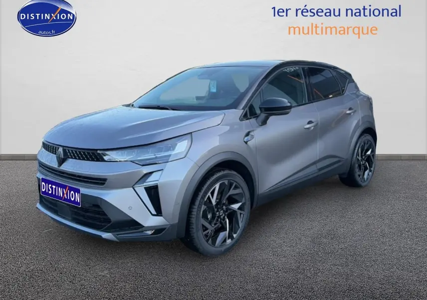Renault Captur 1.8 e-tech hybride gris cassiopée vue 3/4 avant droit avec jantes alu noires et toit noir.