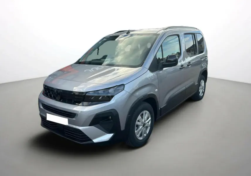 Peugeot Rifter BlueHDi 130 Allure gris Artense en 3/4 avant droit, avec calandre noire et barres de toit visibles.