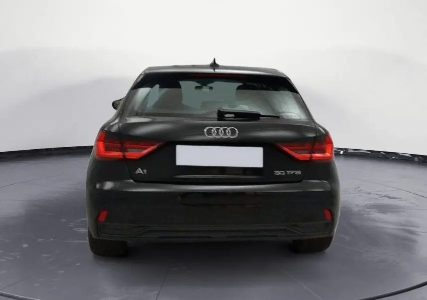 Audi A1 Sportback noir/gris vue de profil côté gauche, avec jantes alliage et lignes épurées.