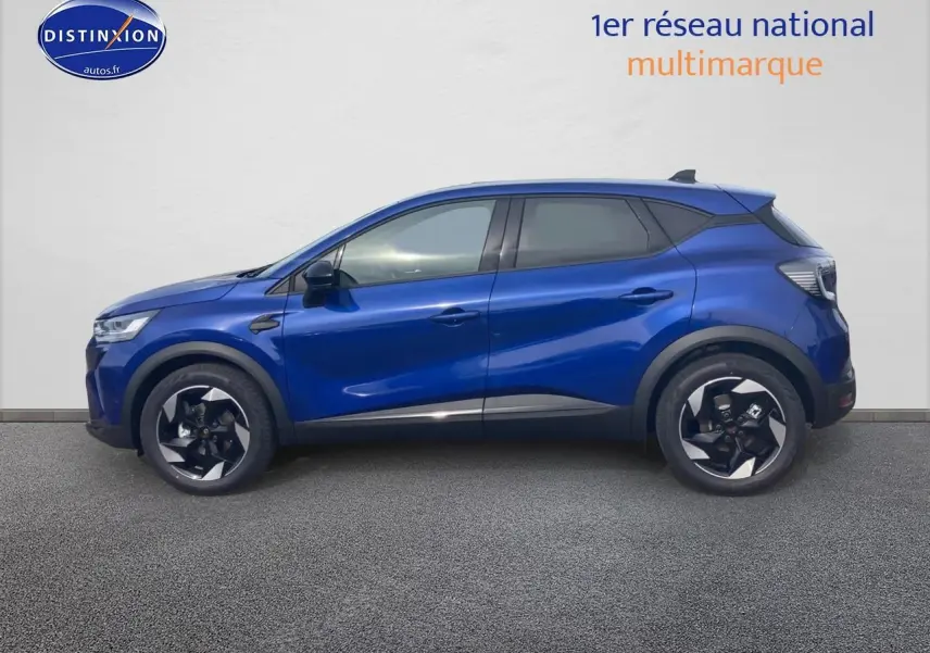 Renault Captur 2025 bleu iron en profil droit, avec jantes alliage noires et toit noir contrasté.