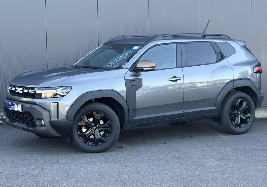 SUV Dacia Duster ECO-G 120 Auto Extrême gris schiste, vue de profil côté gauche avec jantes noires et barres de toit.