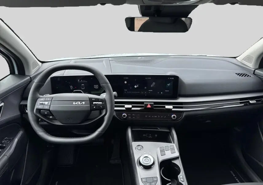 Vue intérieure avant du Kia Sportage 1.6 hybride 239 active, tableau de bord moderne avec écran tactile et volant cuir noir.