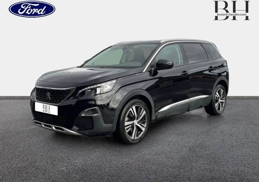 Peugeot 5008 noir Perla Nera vue 3/4 avant droit, avec jantes alliage et barres de toit visibles.