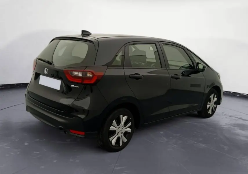 Honda Jazz E:HEV 1.5 i-MMD Advance noir vue 3/4 arrière droit, avec feux arrière distinctifs et toit compact.