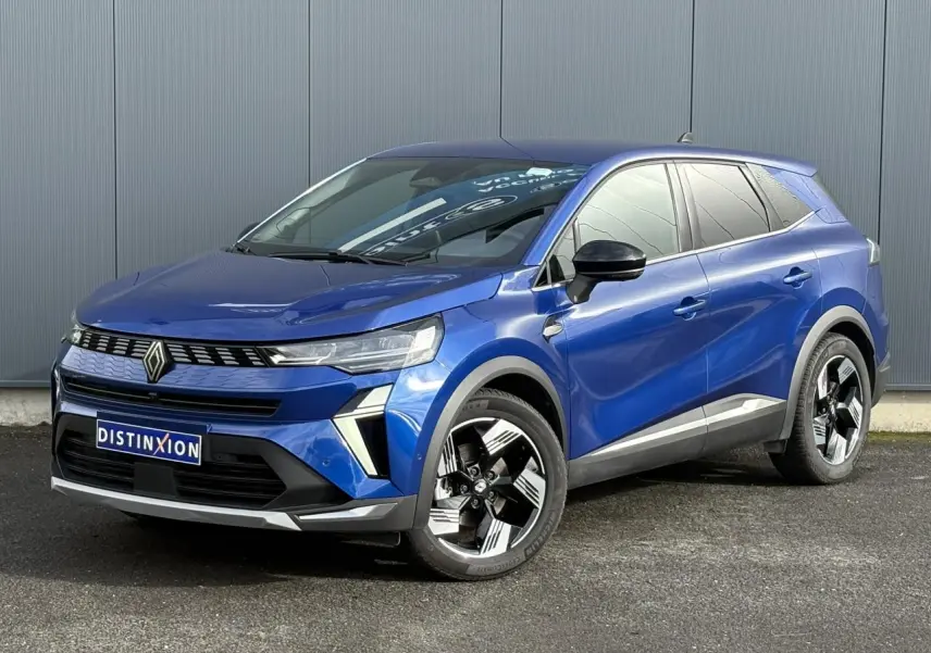 Renault Symbioz E-Tech hybride bleu Iron en 3/4 avant droit avec jantes 18 pouces et détails noirs contrastés.