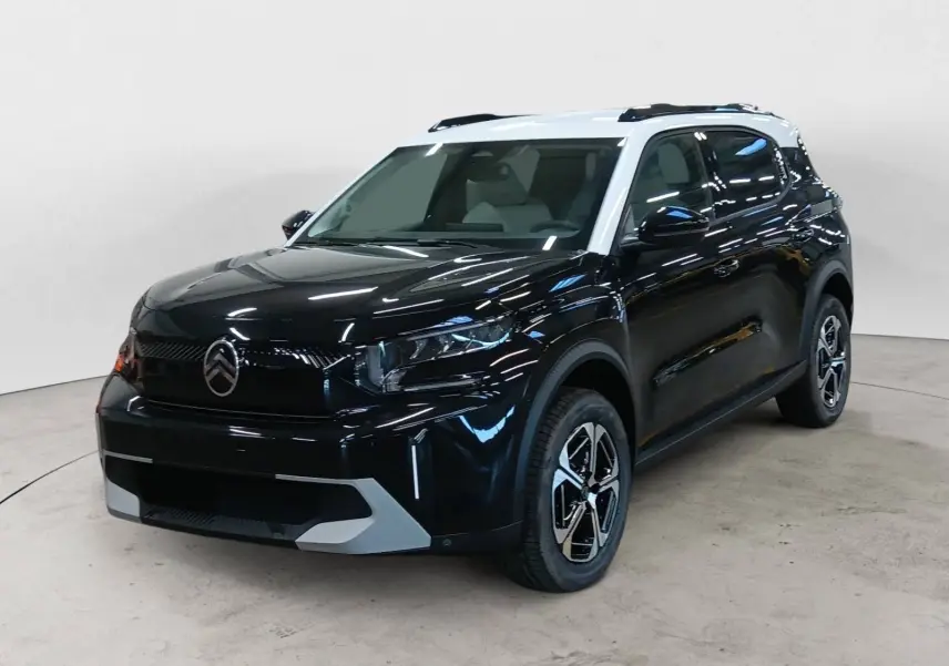 Citroën C3 Aircross hybride 2025 noir perla avec toit blanc, vue 3/4 avant droit mettant en valeur ses jantes biton.
